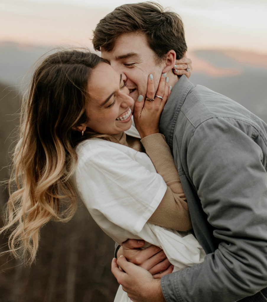 Couple embraces at surprise proposal 