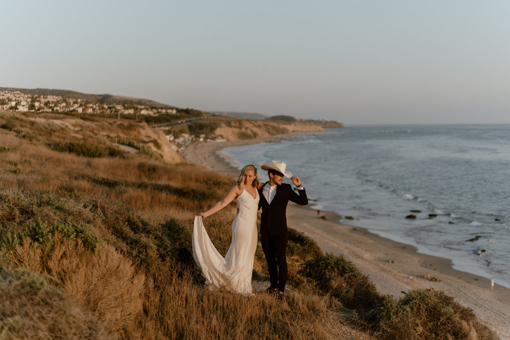 Couple embraces at california coast adventurous elopement