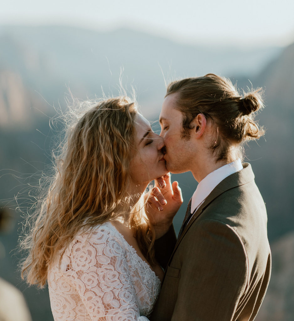 Couple kisses at Zion overlook adventure elopement