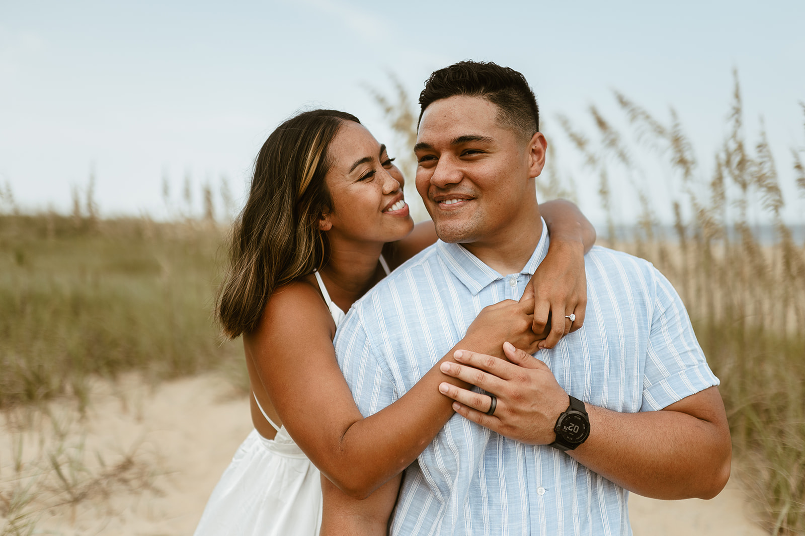 Couple embraces at Virginia Beach elopement