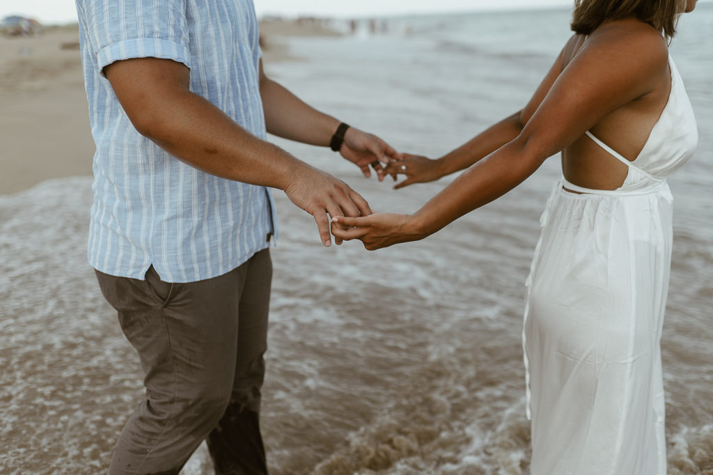 Couple holds hands at Virginia Beach elopement