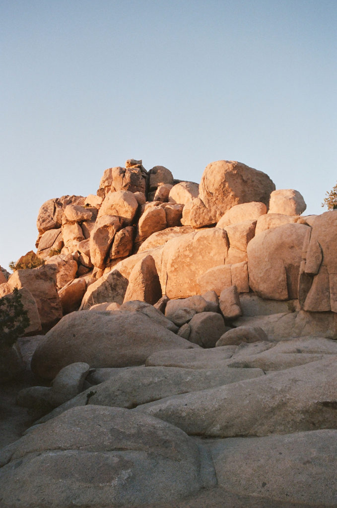 Rocks going into shadow at sunset in desert photo taken by photographer as she compares film photography vs digital