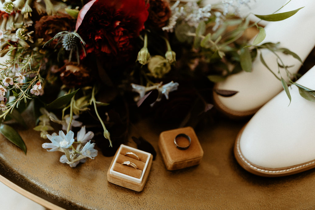 Wedding bands, shoes, and wedding bouquet at Joshua Tree wedding