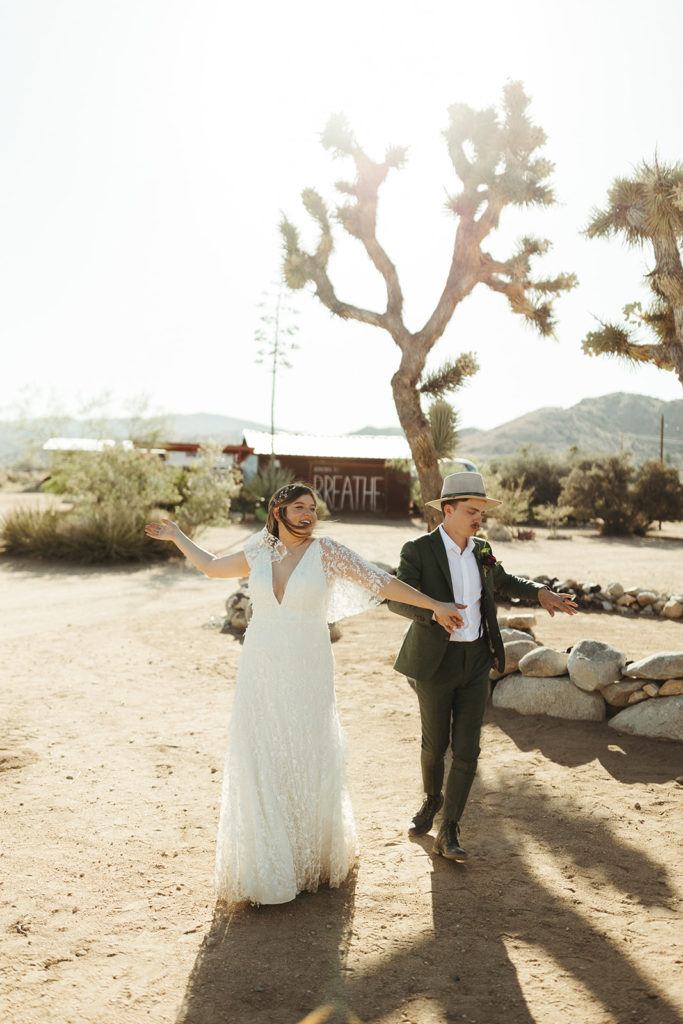 Couple dances in desert at Joshua Tree elopement