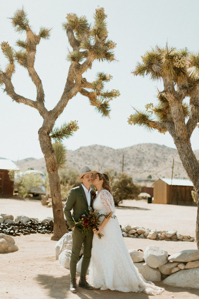 Couple kisses in desert captured by traveling photographer