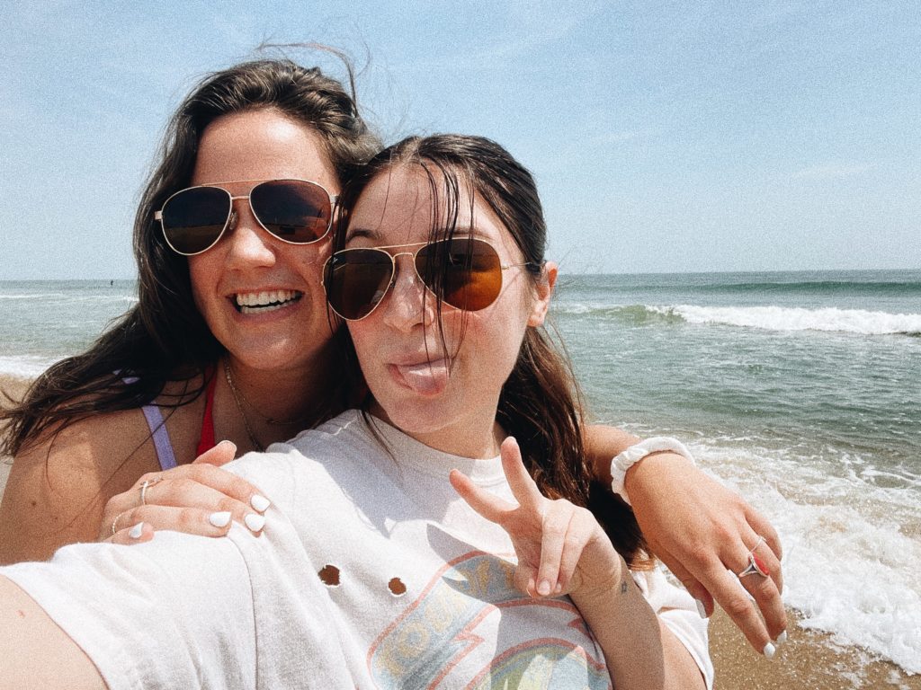 two girls pose in photo together by Virginia Beach oceanfront