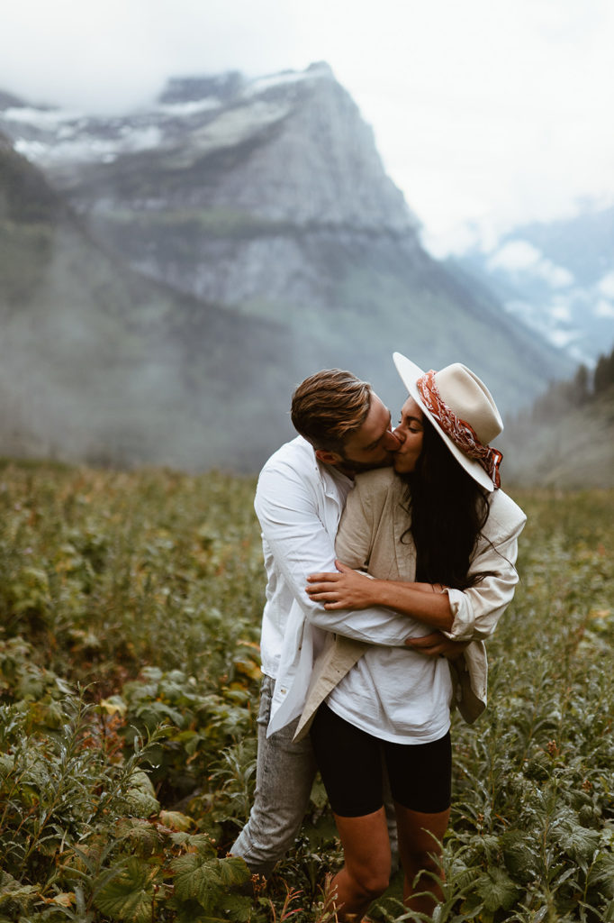 couple kisses at Glacier National Park elopement