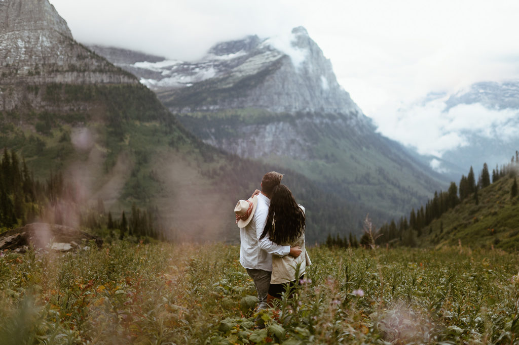 couple embraces at Glacier National Park elopement