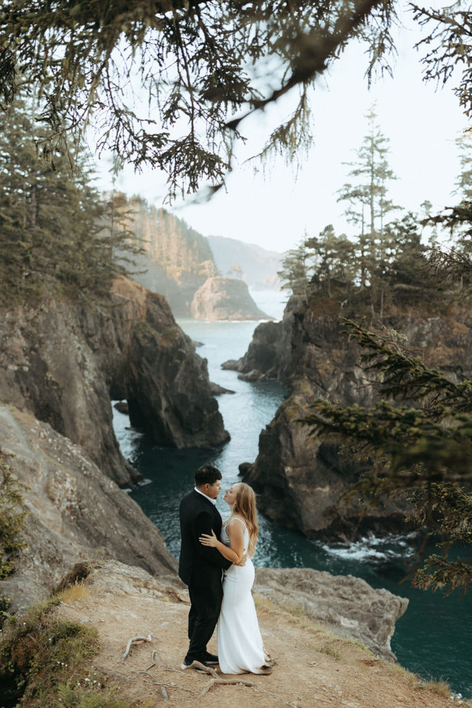 couple embraces at Oregon Coast overlook elopement wedding photoshoot