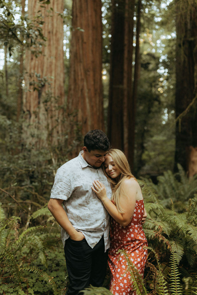 couple embraces at sunset engagement session