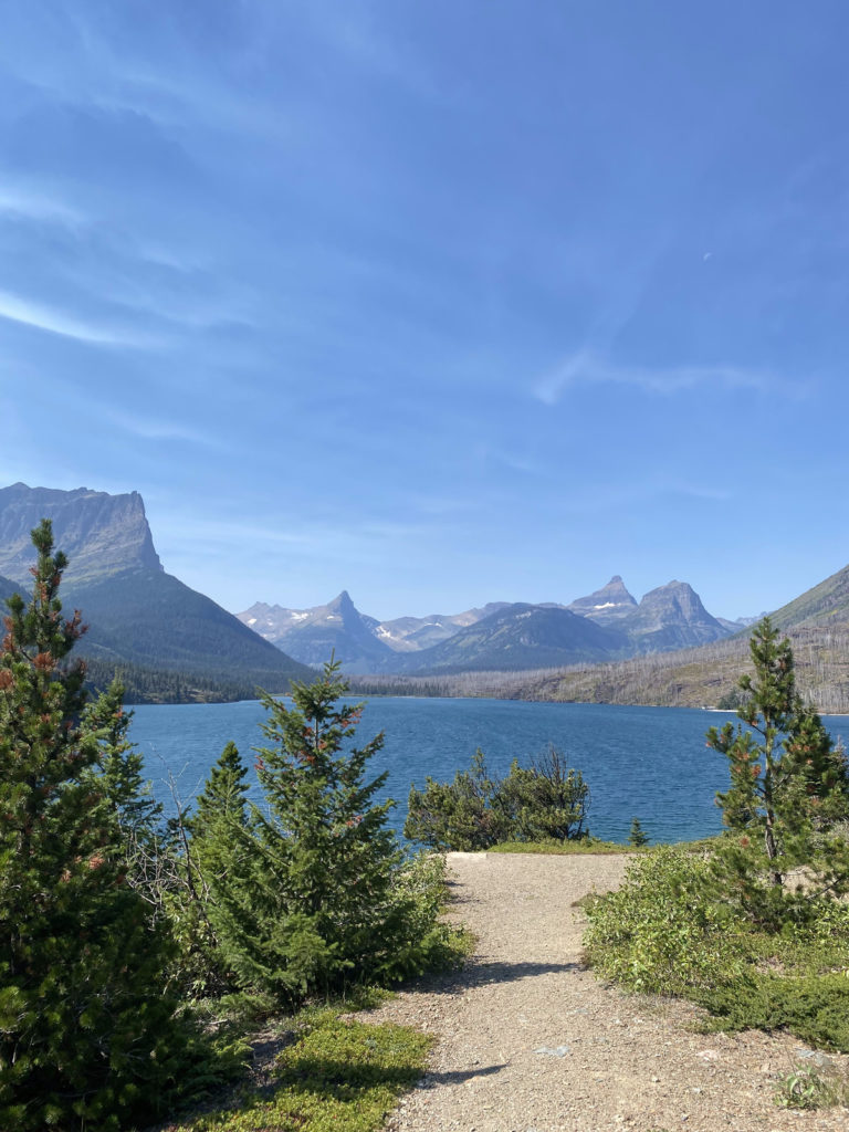 lake under mountains at Sun Point Nature Trail in Glacier National Park