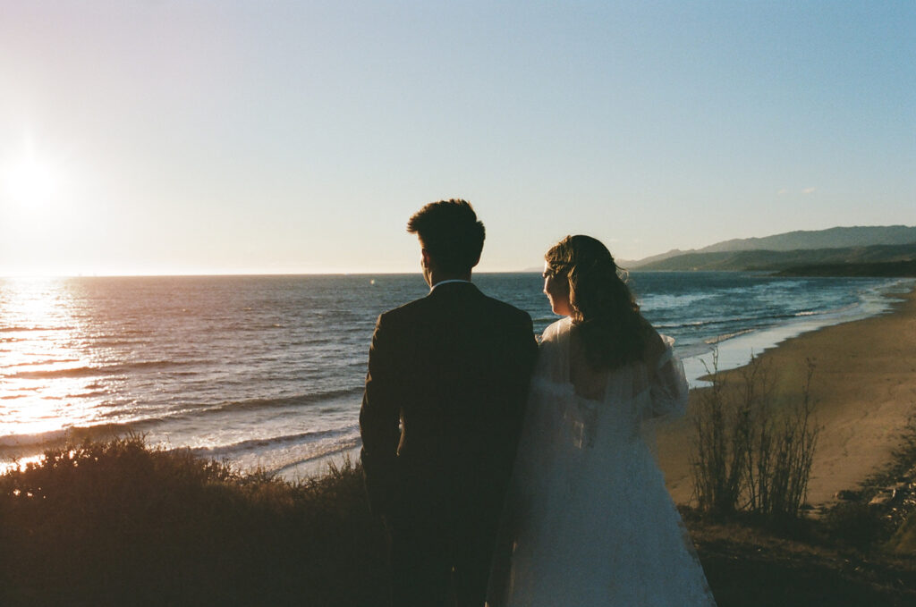 couple overlooks California sunset as part of wedding film photography project