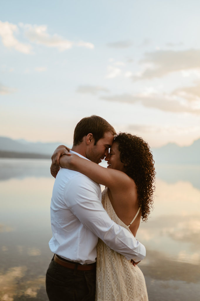 couple embraces at Montana sunset engagement session