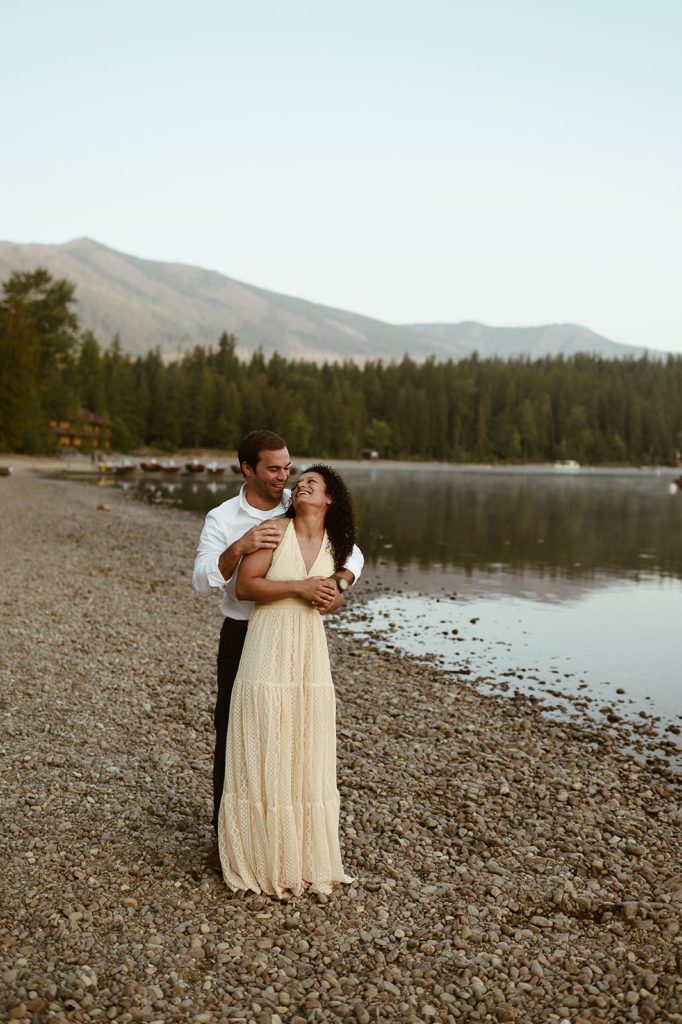 couple embraces at Montana sunset engagement session