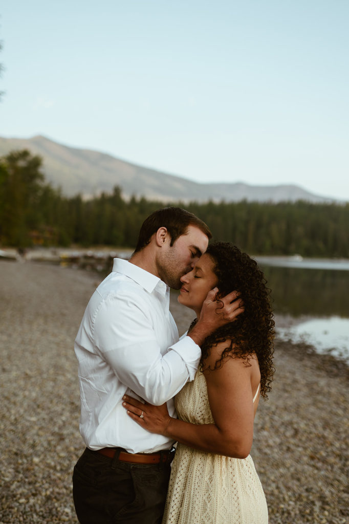 couple kissses at Montana sunset engagement session