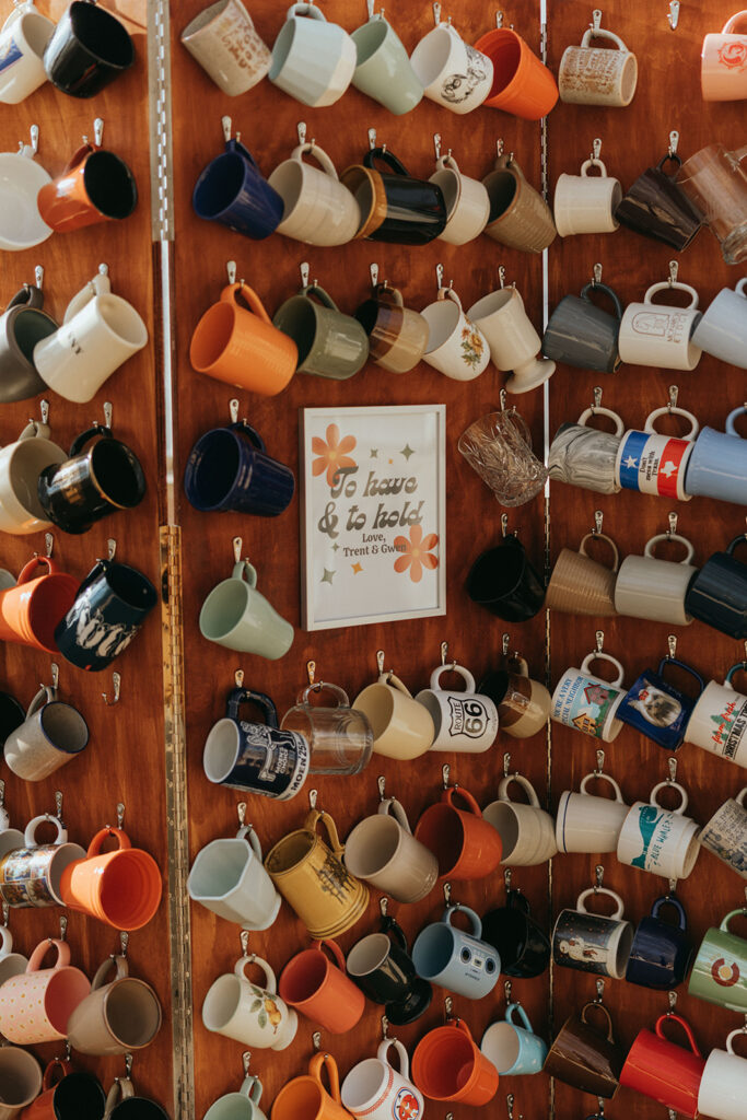 wall of mugs at California greenhouse wedding