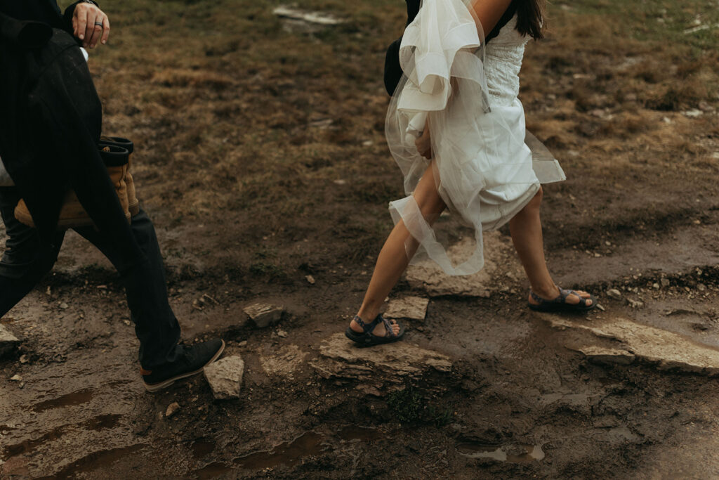bride trashes dress in mud at outdoor adventure elopement