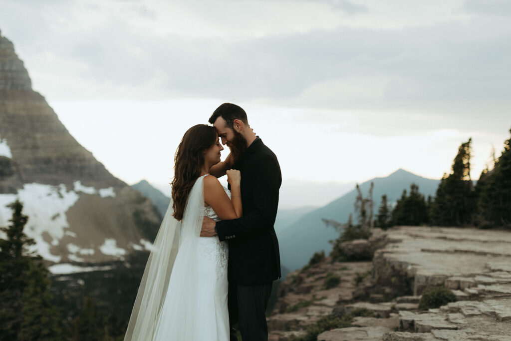 couple embraces at Glacier National Park wedding