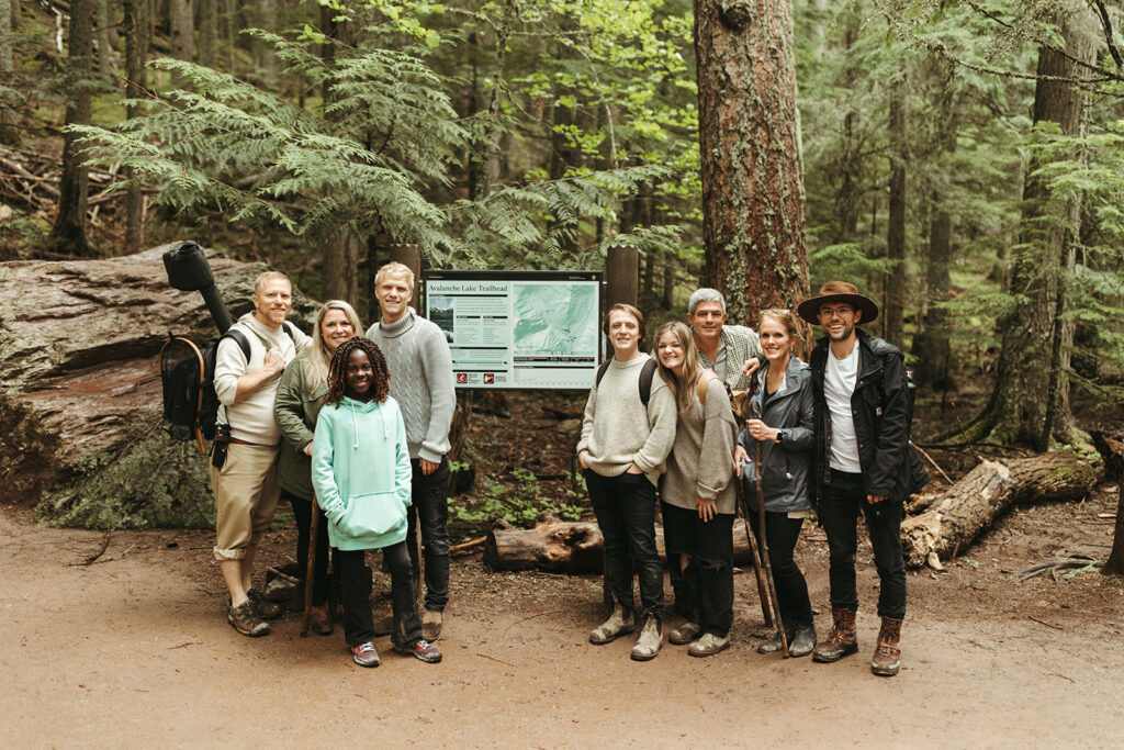 family hikes along path at Glacier National Park