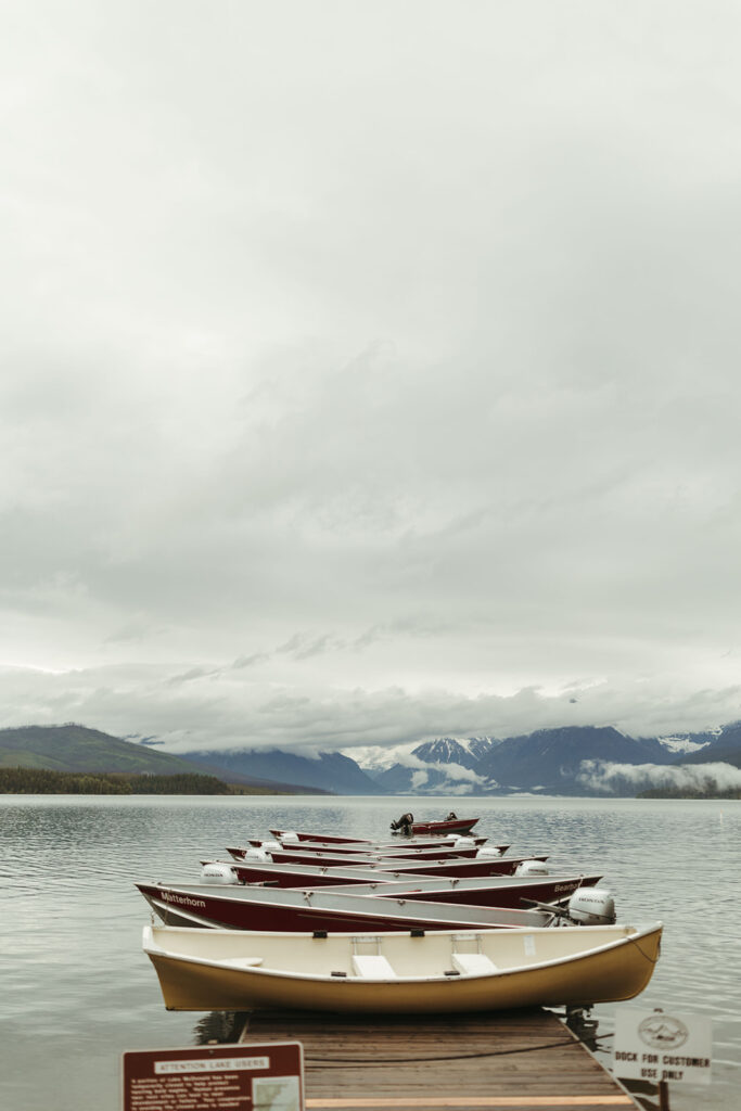 boats on dock at Glacier National Park engagement session