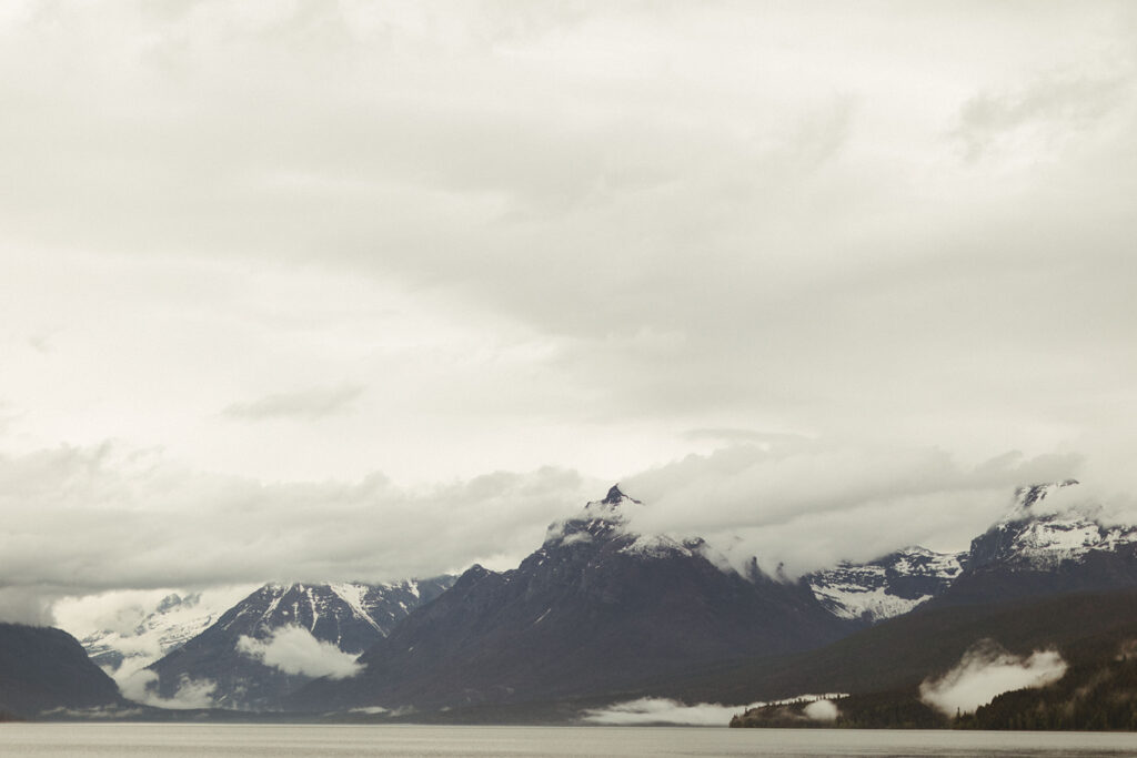 cloud covered mountains at Glacier National Park engagement session