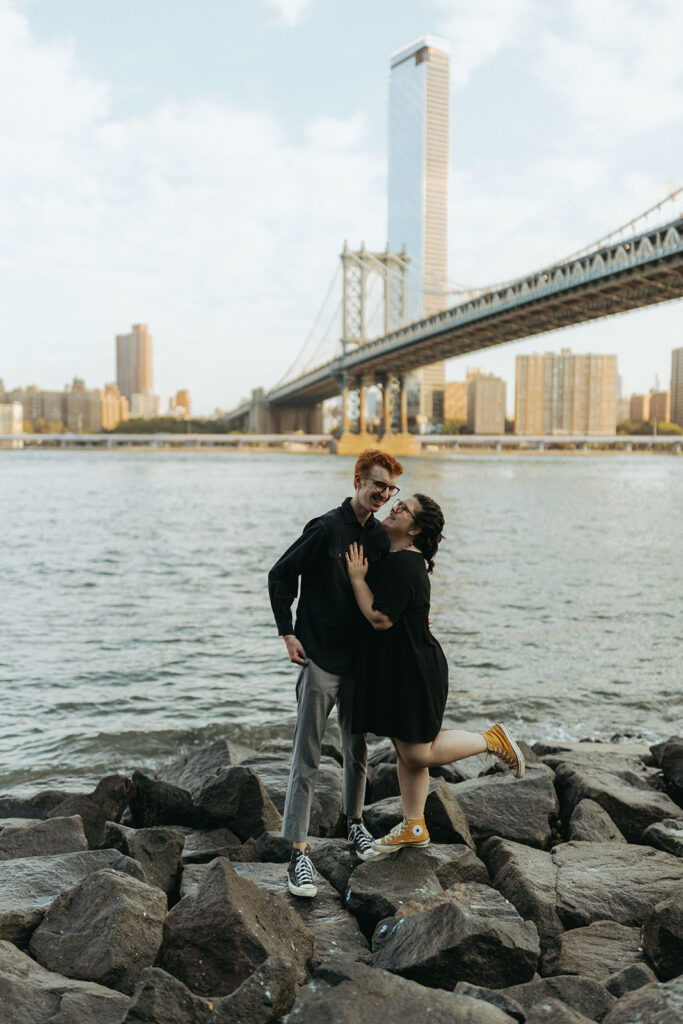 couple stands by brooklyn waterside 