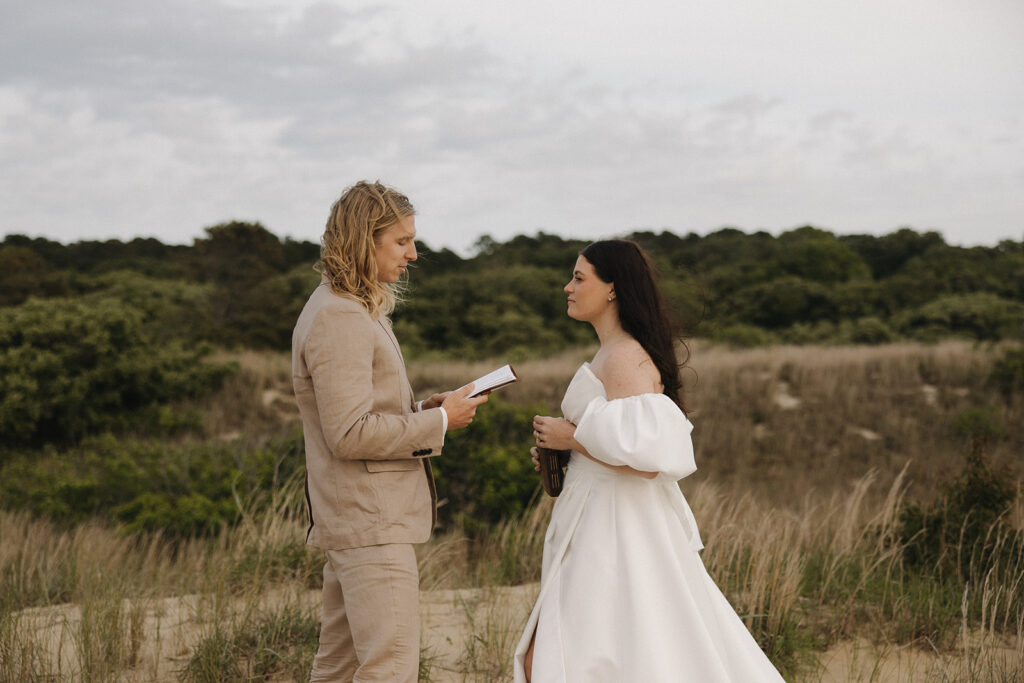 couple exchanges wedding vows at Virginia Beach elopement