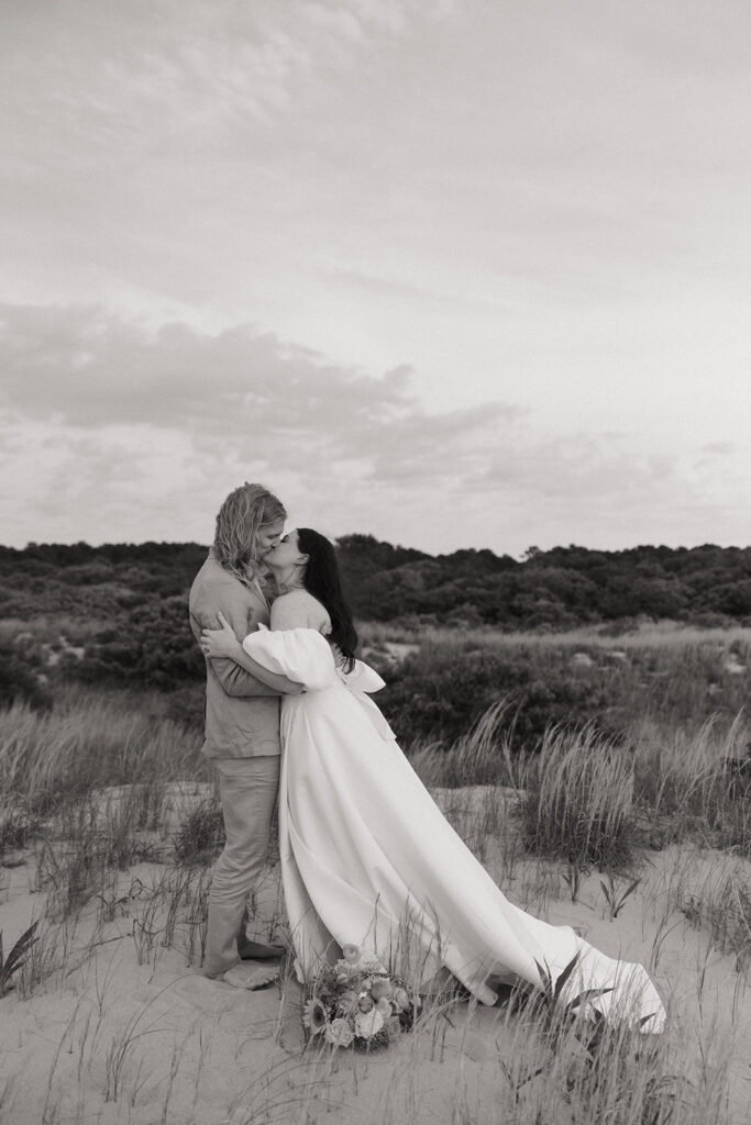 couple kisses at Virginia Beach elopement