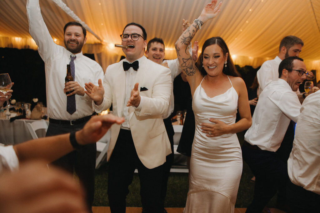 couple dances at outdoor wedding with tent