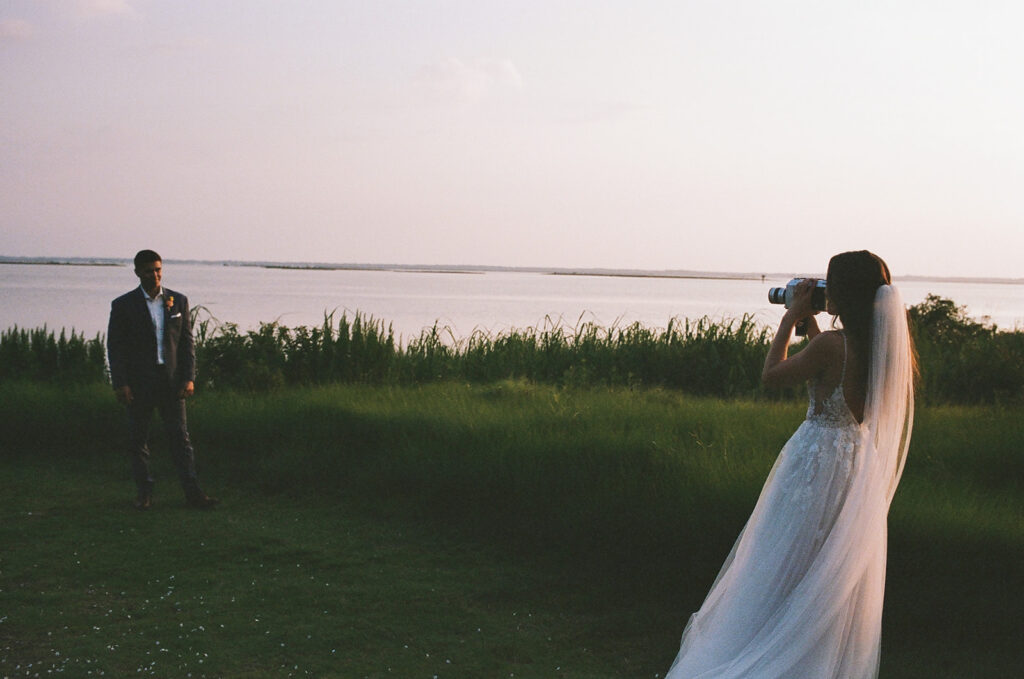 bride shoots video of groom on wedding day