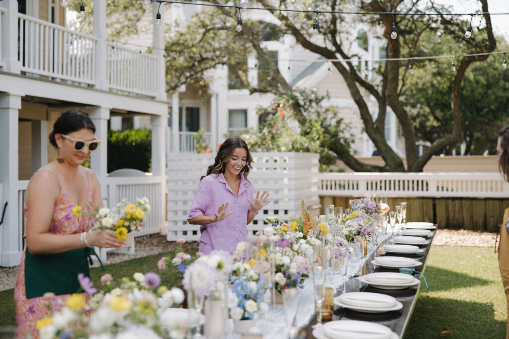 bride is surprised by floral decor at wedding reception in backyard