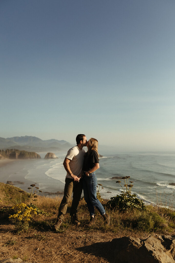 couple kisses at Oregon coast couples session