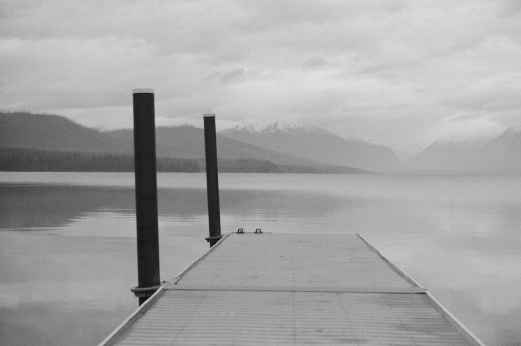 pier along lake at Glacier National Park with film photography on 35mm
