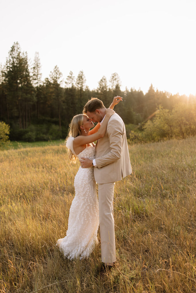 bride and groom lean together touching foreheads at creekside meadows