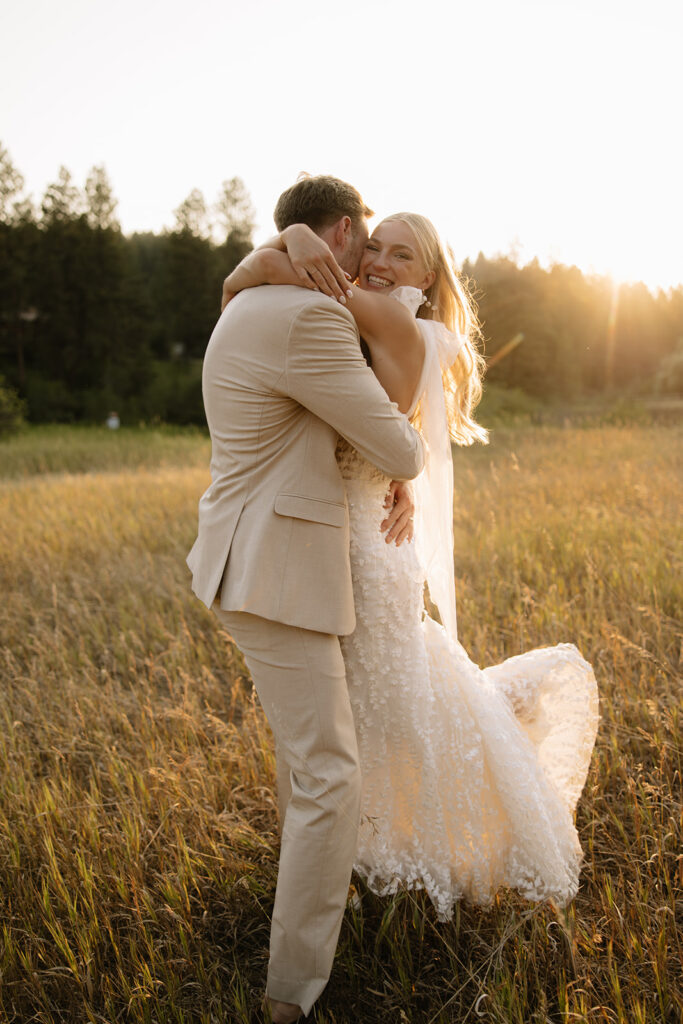 Couple embraces and hugs as the sun sets at montana wedding venue