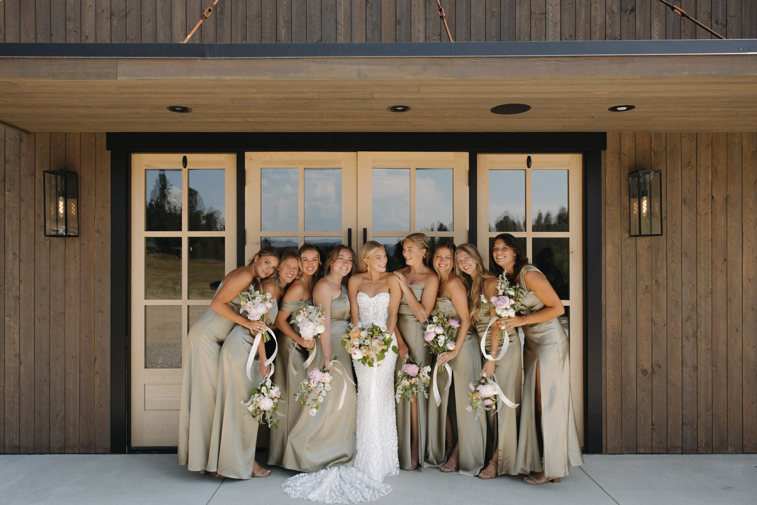 bridesmaids laughing together at montana wedding venue