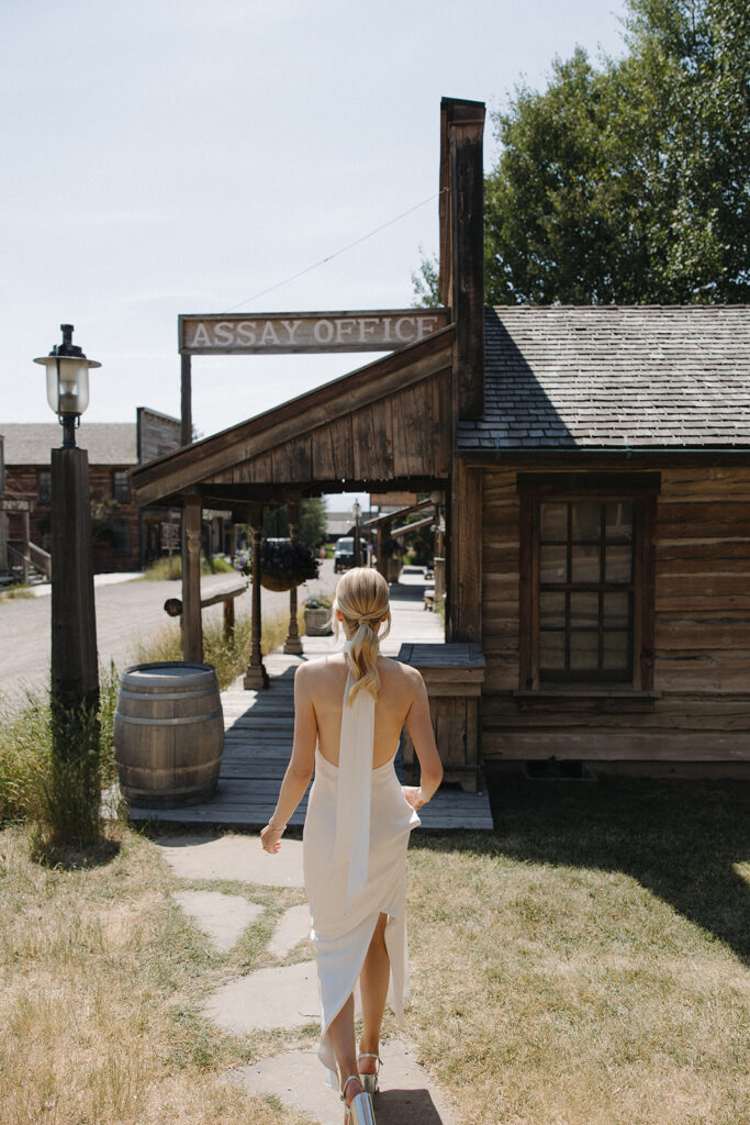 bride walking through a western town