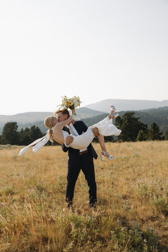 bride and groom kiss at montana intimate wedding