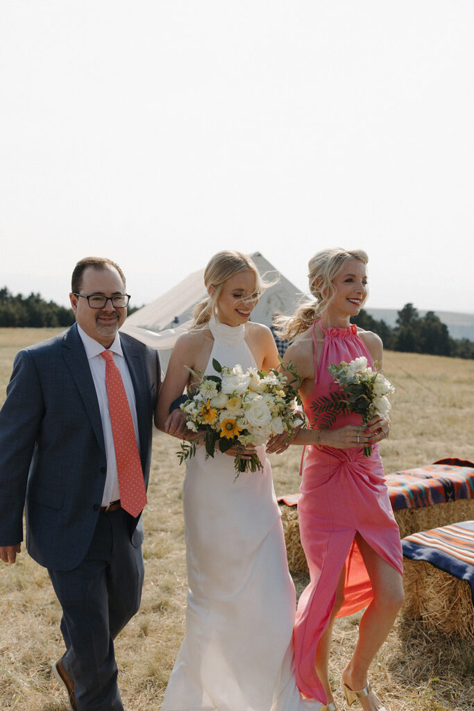 bride walks down the aisle at montana intimate wedding