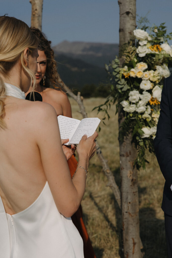 bride reads vows at montana intimate wedding