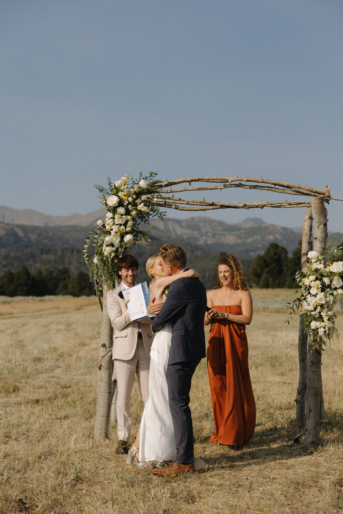 bride and groom kiss at montana intimate wedding