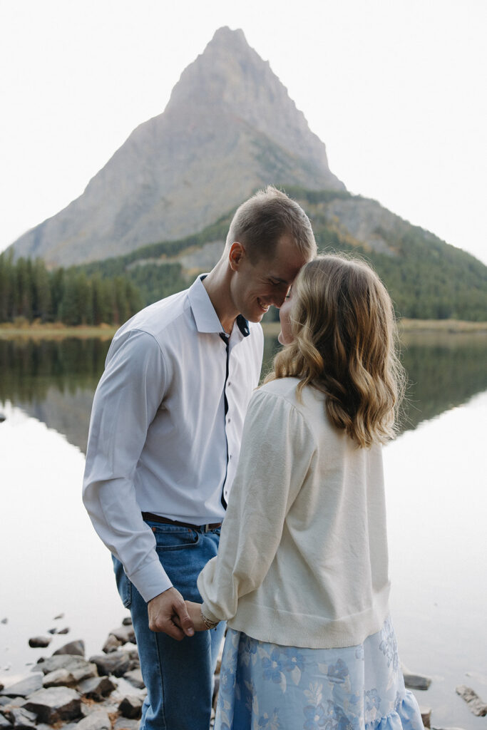 Couple standing at Swiftcurrent Lake