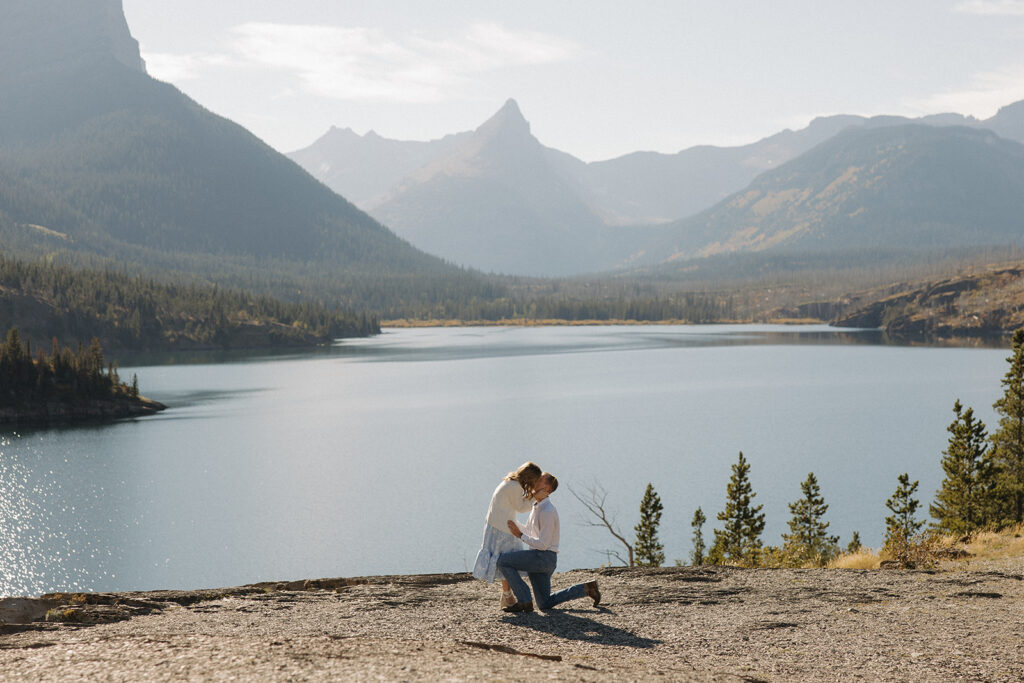 Couple kissing at Sun Point in Glacier National Park