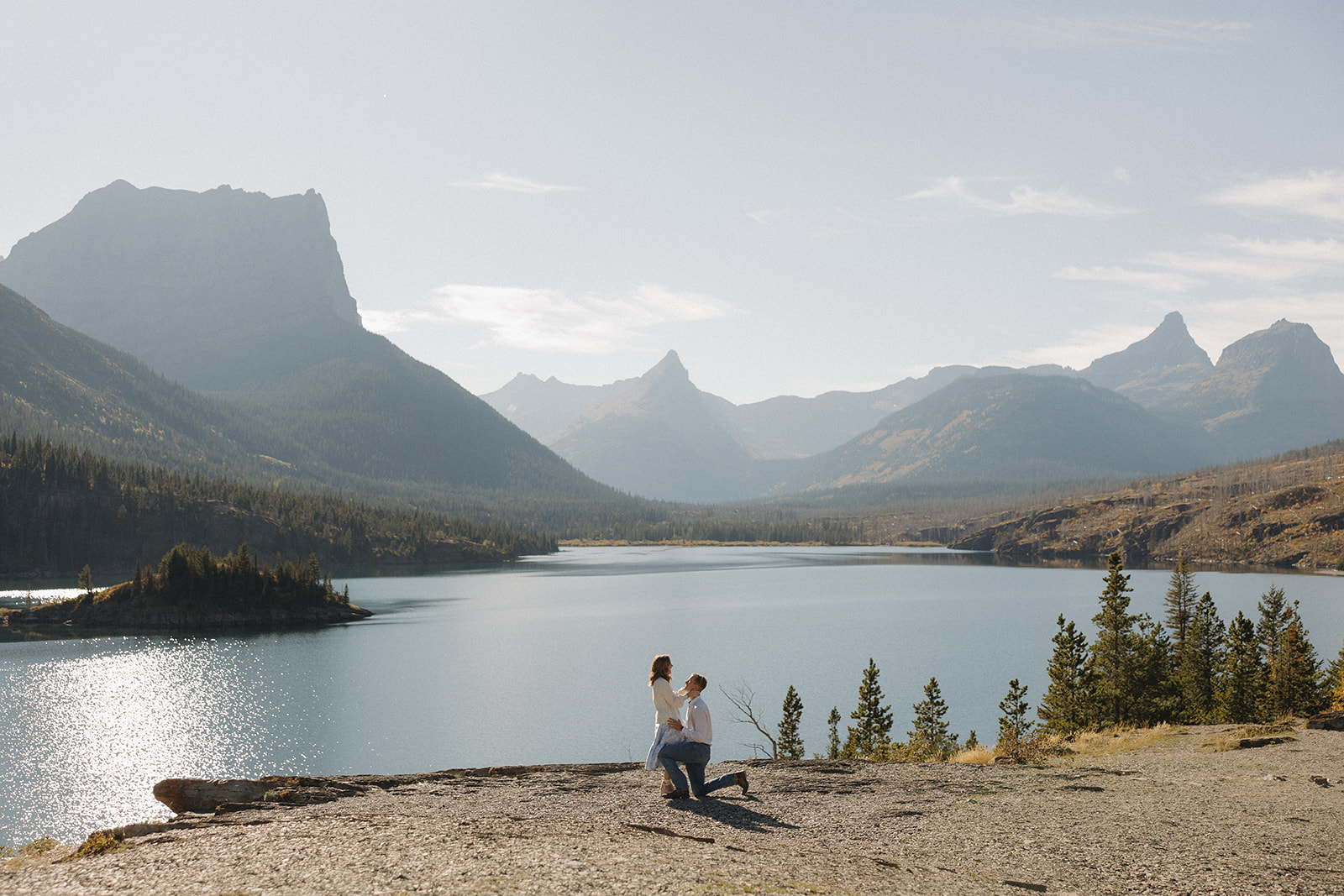 Paul proposing to Caroline at Sun Point in Glacier National Park