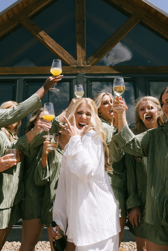 Bridesmaids cheering with mimosas at Three Peaks Ranch Westcliffe Colorado