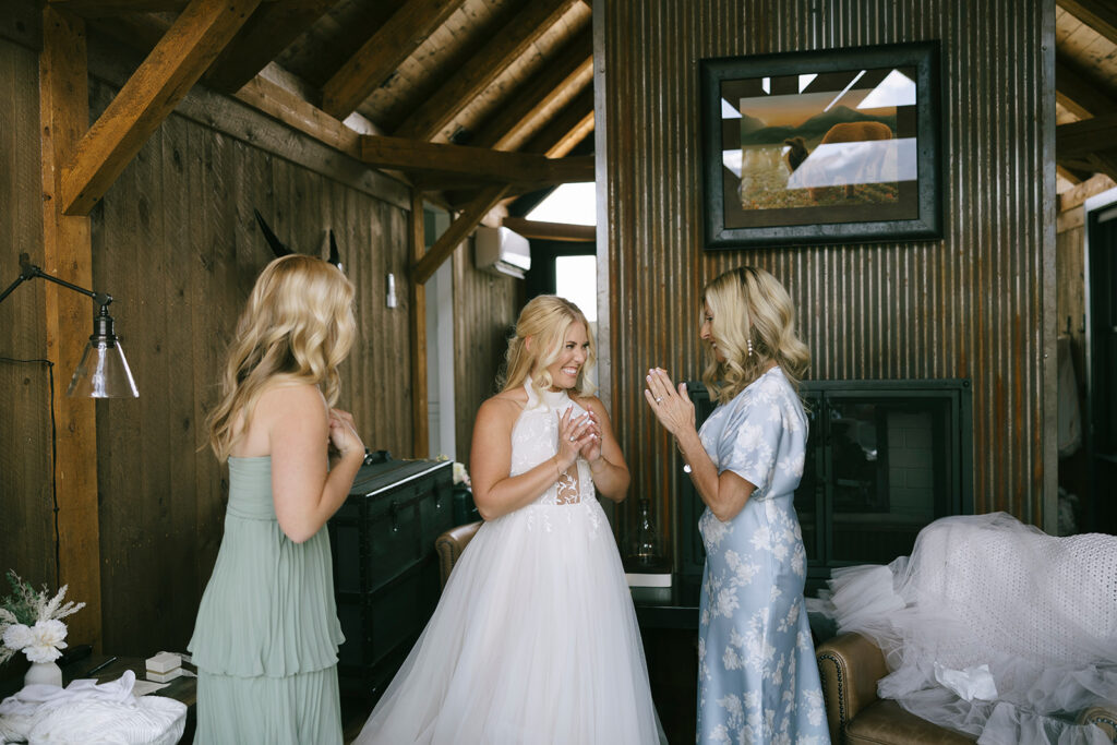 Bride with mom and sister inside Three Peaks Ranch Westcliffe Colorado